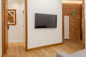 Telewizja i/lub zestaw kina domowego w obiekcie Plaza España V calle San Bernardino 6BR 6BH