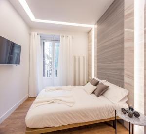 Łóżko lub łóżka w pokoju w obiekcie Plaza España V calle San Bernardino 6BR 6BH