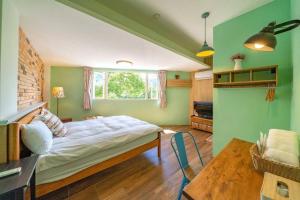 Postel nebo postele na pokoji v ubytování Hejia B&B