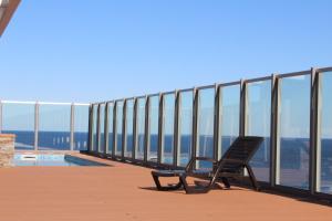 a bench sitting on a balcony with a view at Brava P14 - 1 dorm. (sin sabanas y sin toallas) in Punta del Este