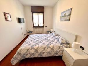 Postel nebo postele na pokoji v ubytování Todeschini 27