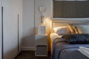 Posteľ alebo postele v izbe v ubytovaní Apartamenty Lighthouse Mrzeżyno