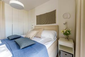 Posteľ alebo postele v izbe v ubytovaní Apartamenty Lighthouse Mrzeżyno