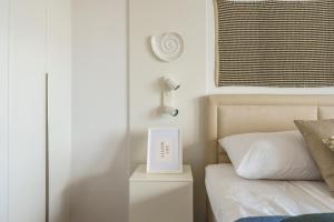 Posteľ alebo postele v izbe v ubytovaní Apartamenty Lighthouse Mrzeżyno