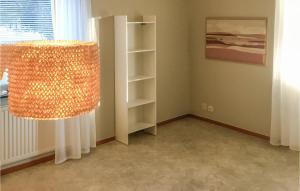 a living room with a chandelier in a room at Amazing Apartment In Kvillsfors in Kvillsfors