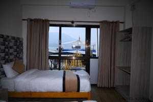 Uma cama ou camas num quarto em Hotel Kaavi