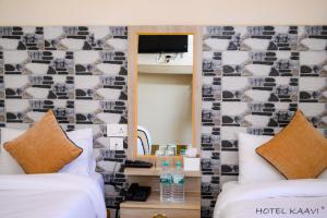Uma cama ou camas num quarto em Hotel Kaavi