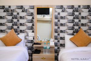 Uma cama ou camas num quarto em Hotel Kaavi