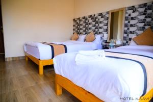 Uma cama ou camas num quarto em Hotel Kaavi