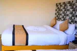 Uma cama ou camas num quarto em Hotel Kaavi