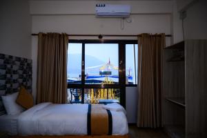 Uma cama ou camas num quarto em Hotel Kaavi