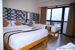 Uma cama ou camas num quarto em Hotel Kaavi