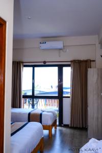 Uma cama ou camas num quarto em Hotel Kaavi