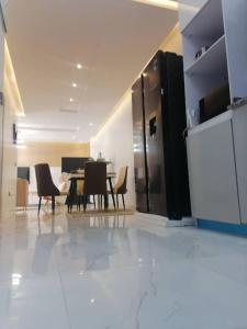 a dining room with a table and chairs in a room at Beautiful 2 bedroom in Ologolo in Lekki