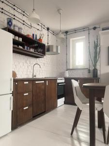 Virtuvė arba virtuvėlė apgyvendinimo įstaigoje Comfort Apartments Oliwa Gdańsk