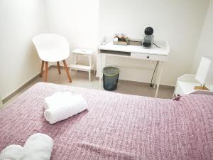 Postel nebo postele na pokoji v ubytování B&B S'arciaredda