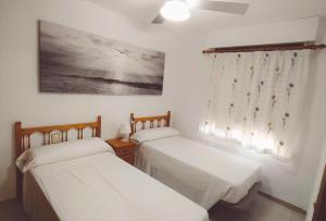 Postel nebo postele na pokoji v ubytování Apartamento Cumbremar superior Orange Costa