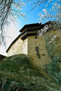 a building with a roof on top of a hill at Boutique Plakias Guesthouse ex Boutique Holy Spirit in Kalabaka