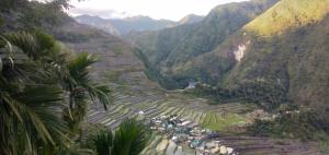 an aerial view of the ancient terraces in the mountains at Batad Lhorens Inn and Restaurant in Banaue