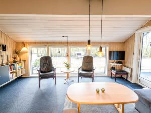 a living room with a table and chairs at 6 person holiday home in Fanø in Fanø