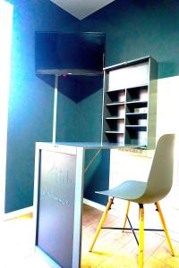 a table and a chair in a room at Apartment Bigler in Osloß