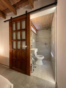 a bathroom with a toilet and a sink at Encantador Duplex cerca de todo in Cordoba