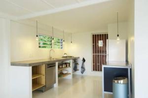 a kitchen with a sink and a counter top at Idyllic Curacao Home with Stunning Views in Willemstad