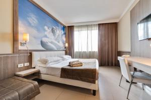 Postel nebo postele na pokoji v ubytování Eracle Hotel