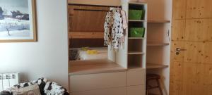 a kitchen with a refrigerator in a room at Chambres d'hôtes Au Doubs Murmure in Les Fins