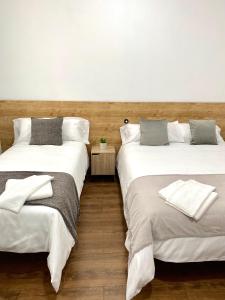 En eller flere senger på et rom på Apartamentos Fuencarral II