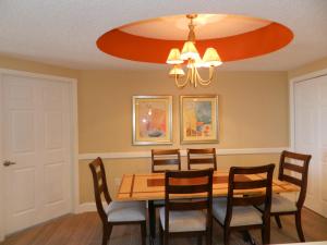 a dining room with a table and chairs at Ocean Walk Resort 2332 - Just Updated 2 BR Deluxe North Tower in Daytona Beach
