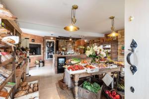 a store filled with lots of fruits and vegetables at The Cotswold Lady in Guiting Power