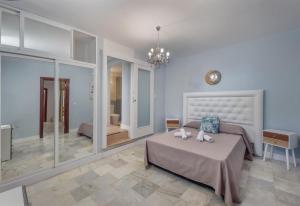 Posteľ alebo postele v izbe v ubytovaní Villa Domus Vesta