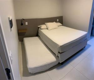 Ένα ή περισσότερα κρεβάτια σε δωμάτιο στο Liiv Cobogó - Natal Ponta Negra