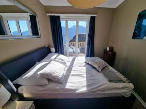 a bed in a room with a window at Boutique Centrale in Brione sopra Minusio