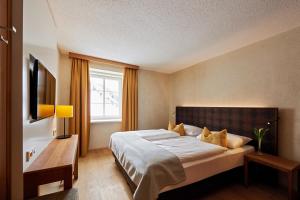 Letto o letti in una camera di Après Post Hotel