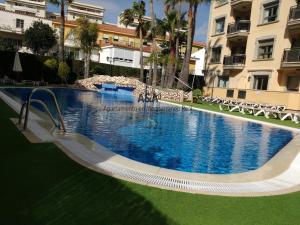 a large swimming pool in the middle of a building at Apartamento En Mediterráneo Real, Los Boliches, Fuengirola in Fuengirola