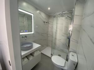 a bathroom with a toilet and a sink and a shower at Acapulco playa Nerja 407 planta superior in Nerja