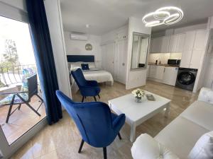a living room with a couch and a table at Acapulco playa Nerja 407 planta superior in Nerja