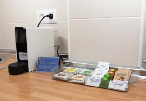 a box of food sitting on the floor with a lamp at Acapulco playa Nerja 407 planta superior in Nerja