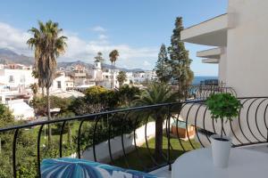 a balcony with a view of a city at Acapulco playa Nerja 407 planta superior in Nerja