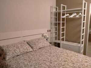 a bedroom with a bed next to a bunk bed at Smart Home Centro Storico in Collegno