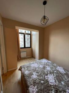 Säng eller sängar i ett rum på Tbilisi appartement