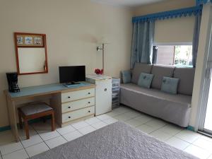 TV a/nebo společenská místnost v ubytování Studio CRISTAL COCO Martinique
