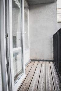 an empty balcony with a sliding glass door at NSD Home in Antwerp