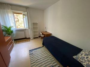 Un ou plusieurs lits dans un hébergement de l'établissement Udine Urban Stay