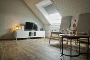 TV a/nebo společenská místnost v ubytování Chez Felix gezellig vakantiehuis nabij Durbuy