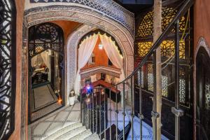 an overhead view of a staircase in a house with a gate at Atrium Konak in Novi Sad