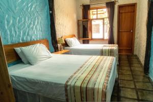 Cama o camas de una habitación en Mi caleta en Galápagos