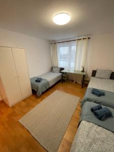 Posteľ alebo postele v izbe v ubytovaní Podkarpacka 50
